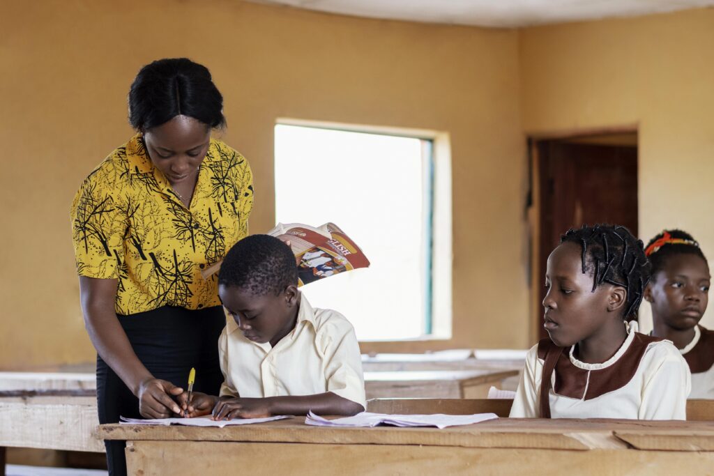 african woman teaching children class