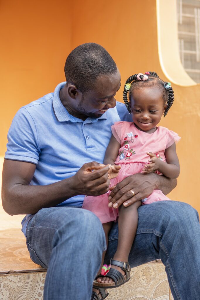 Raising Responsible Children in Today’s Nigeria: 7 Biblical and Practical Tips How to Sell Charity to a Skeptic father holding his little black girl